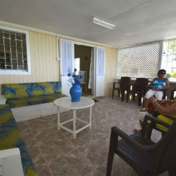 Inside Barbados Beach Cottage Porch Area